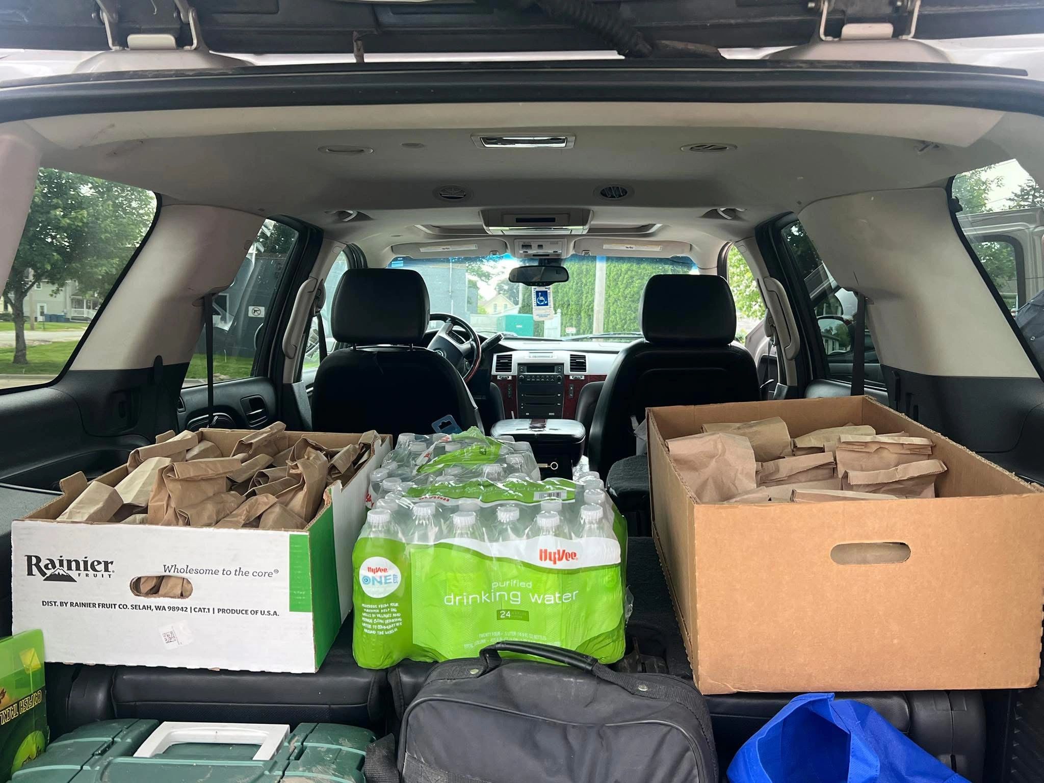 Vehicle packed with groceries and supplies for distribution